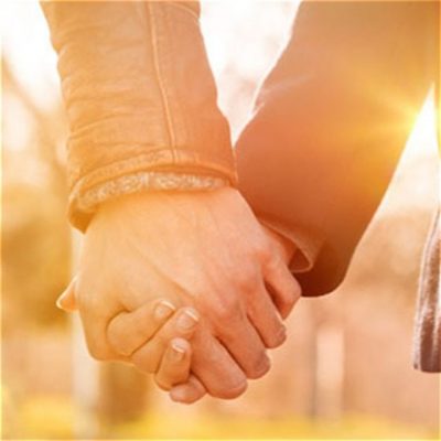 Two people holding hands